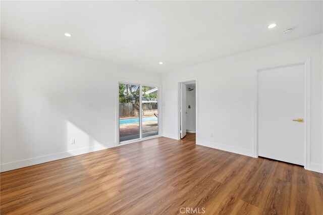 2291 Halcyon Way, Pomona, CA 91767 - empty room featuring wood finished floors, baseboards, and recessed lighting