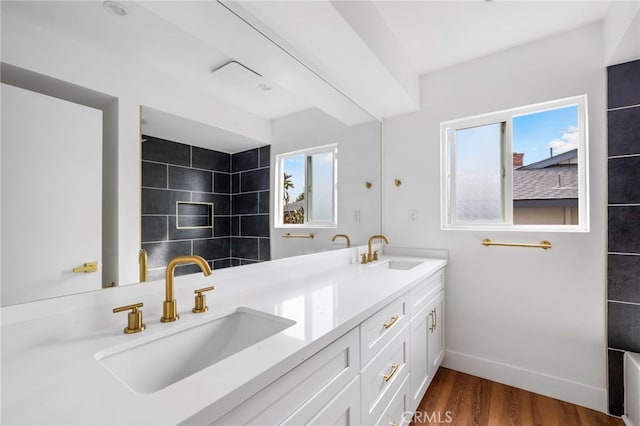 2291 Halcyon Way, Pomona, CA 91767 - bathroom featuring wood finished floors, baseboards, and double vanity