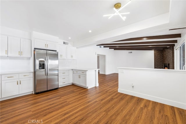 2291 Halcyon Way, Pomona, CA 91767 - kitchen featuring stainless steel refrigerator with ice dispenser, a peninsula, white cabinets, dark wood finished floors, and light countertops