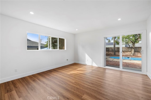 2291 Halcyon Way, Pomona, CA 91767 - spare room with baseboards, wood finished floors, and recessed lighting