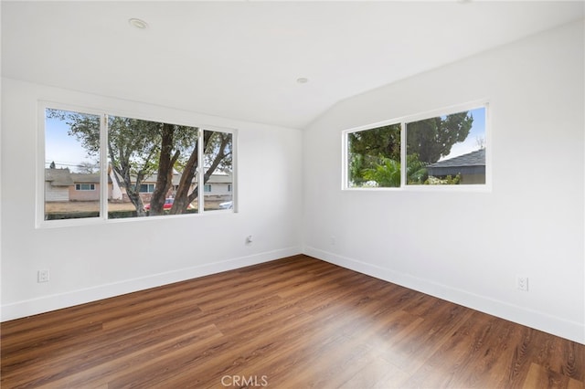 2291 Halcyon Way, Pomona, CA 91767 - empty room featuring healthy amount of natural light, lofted ceiling, baseboards, and wood finished floors