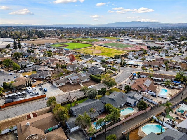 2291 Halcyon Way, Pomona, CA 91767 - aerial perspective of suburban area with a pool and a mountain backdrop