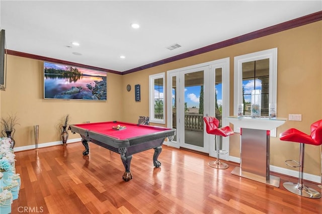 playroom with baseboards, crown molding, wood finished floors, billiards table, and french doors