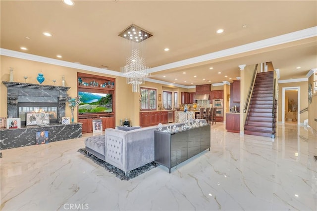 living room with ornamental molding, recessed lighting, light marble finish flooring, stairway, and a chandelier