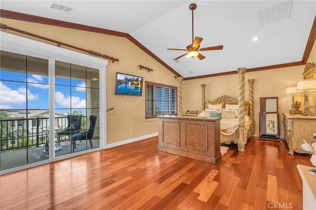 bedroom with access to outside, wood finished floors, vaulted ceiling, baseboards, and ornamental molding