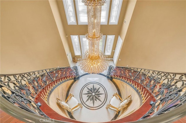detailed view of a chandelier and wood finished floors