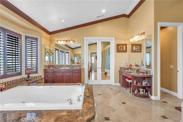 bathroom featuring crown molding, vaulted ceiling, french doors, a bath, and plenty of natural light