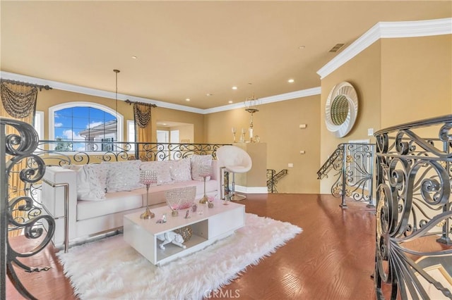 living room featuring ornamental molding, wood finished floors, and recessed lighting