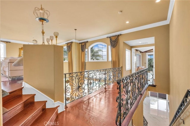 hallway with crown molding and recessed lighting