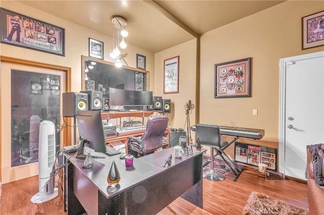 home office with wood finished floors