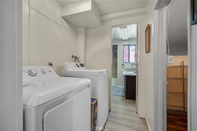 21964 Mojave River Rd, Cedarpines Park, CA 92322 - washroom featuring independent washer and dryer and light wood-style flooring