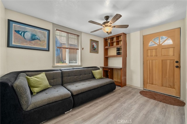 21964 Mojave River Rd, Cedarpines Park, CA 92322 - living area with light wood-style floors, ceiling fan, and baseboards
