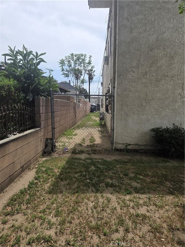 270 E 6th St, Pomona, CA 91766 - view of yard featuring fence