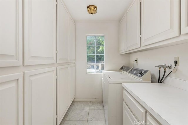 2484 Chauncy Pl, Riverside, CA 92506 - clothes washing area featuring light marble finish floors, cabinet space, separate washer and dryer, and baseboards