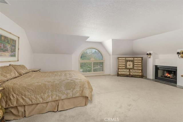 2484 Chauncy Pl, Riverside, CA 92506 - carpeted bedroom featuring lofted ceiling and a fireplace with flush hearth