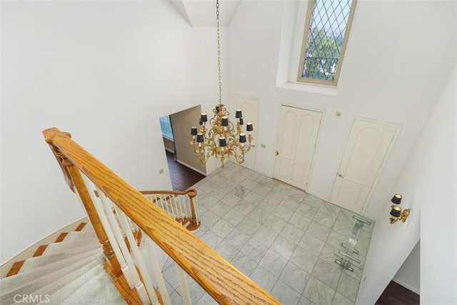 2484 Chauncy Pl, Riverside, CA 92506 - foyer entrance featuring a high ceiling, a chandelier, and baseboards