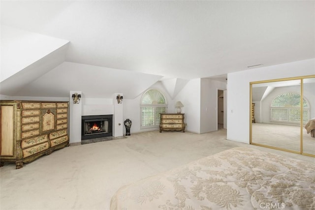 2484 Chauncy Pl, Riverside, CA 92506 - bedroom featuring carpet flooring, a fireplace with flush hearth, lofted ceiling, and a closet