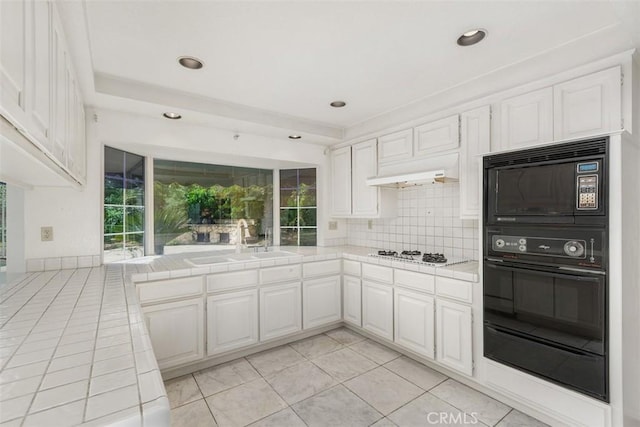 2484 Chauncy Pl, Riverside, CA 92506 - kitchen featuring tile countertops, a sink, white gas cooktop, under cabinet range hood, and white cabinetry