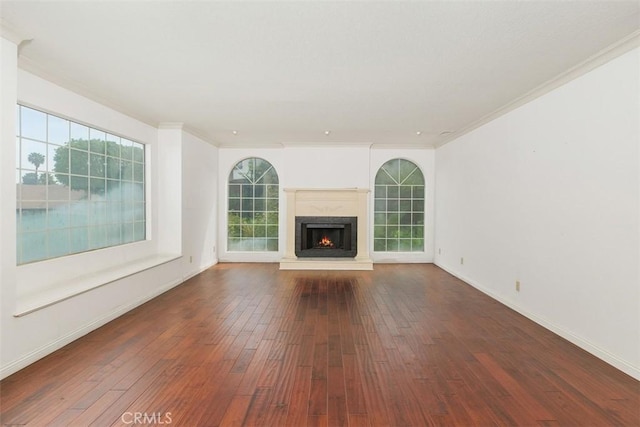2484 Chauncy Pl, Riverside, CA 92506 - unfurnished living room with hardwood / wood-style flooring, baseboards, a warm lit fireplace, healthy amount of natural light, and ornamental molding