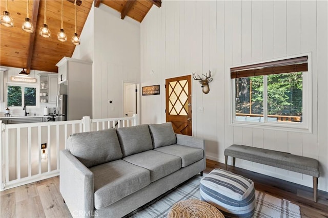 698 W Victoria Ct, Lake Arrowhead, CA 92352 - living room with wood ceiling with exposed beams, light wood-type flooring, plenty of natural light, and high vaulted ceiling