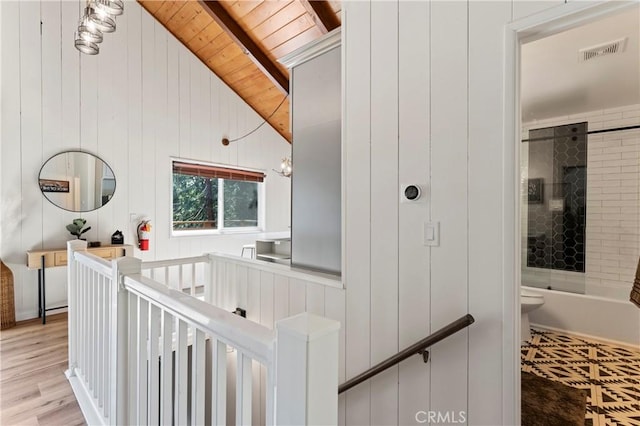 698 W Victoria Ct, Lake Arrowhead, CA 92352 - hall featuring wooden ceiling, an upstairs landing, light wood finished floors, and wood walls