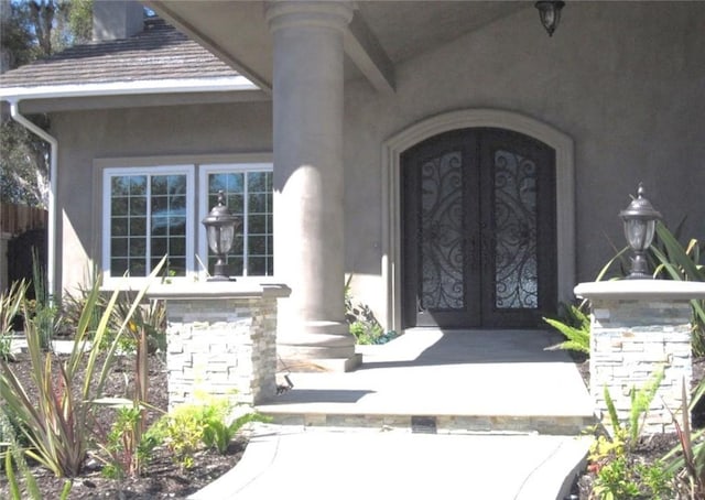26925 Via Grande, Mission Viejo, CA 92691 - doorway to property featuring french doors, stucco siding, and stone siding