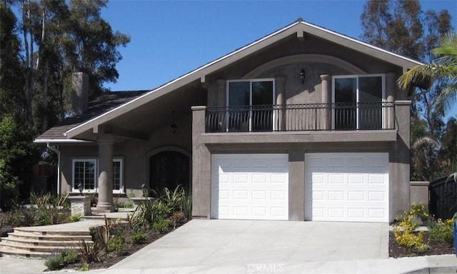 26925 Via Grande, Mission Viejo, CA 92691 - view of front of property with concrete driveway, stucco siding, a balcony, and an attached garage