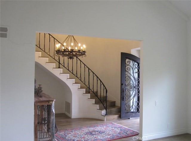26925 Via Grande, Mission Viejo, CA 92691 - foyer entrance with wood finished floors, stairway, a chandelier, and baseboards
