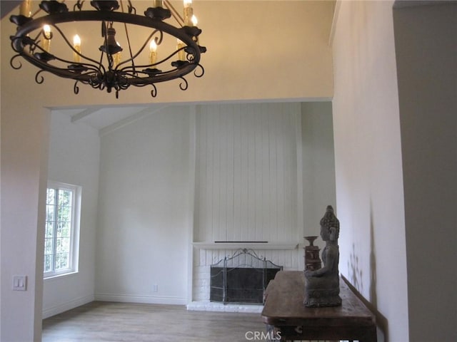 26925 Via Grande, Mission Viejo, CA 92691 - living room with a chandelier, wood finished floors, and a fireplace