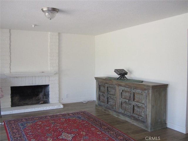 26925 Via Grande, Mission Viejo, CA 92691 - living area with wood finished floors, a brick fireplace, and baseboards