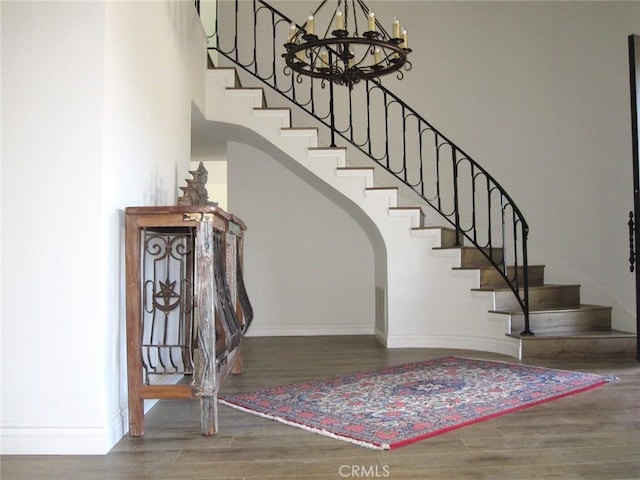 26925 Via Grande, Mission Viejo, CA 92691 - staircase with baseboards, wood finished floors, a chandelier, and arched walkways
