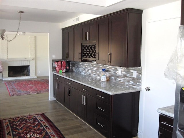 26925 Via Grande, Mission Viejo, CA 92691 - kitchen featuring dark wood-style floors, tasteful backsplash, dark brown cabinetry, and open floor plan