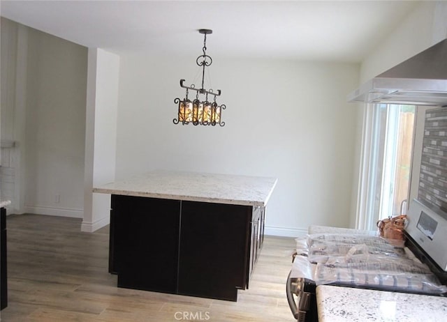 26925 Via Grande, Mission Viejo, CA 92691 - detailed view of a fireplace, wood finished floors, wall chimney range hood, and baseboards