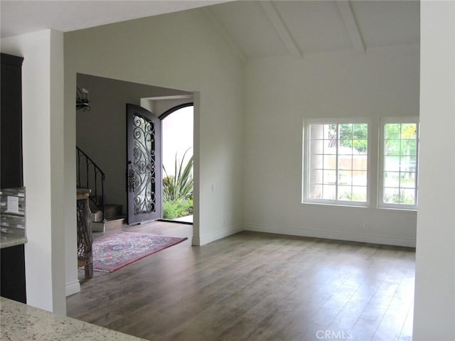 26925 Via Grande, Mission Viejo, CA 92691 - foyer featuring lofted ceiling, wood finished floors, stairway, and baseboards
