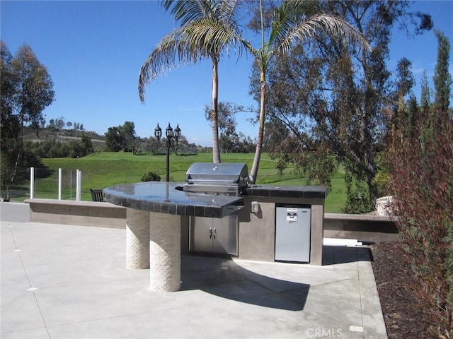 26925 Via Grande, Mission Viejo, CA 92691 - view of home's community with an outdoor kitchen, a lawn, and a patio