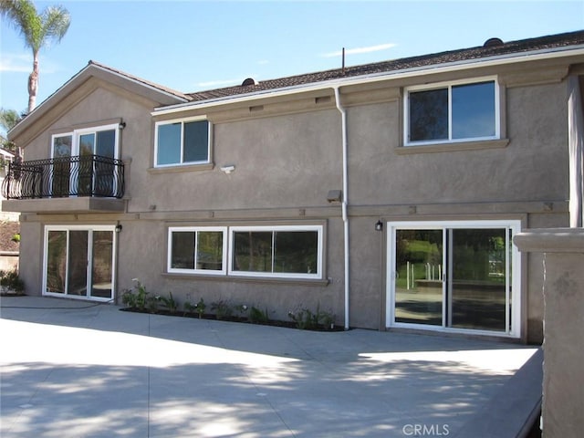 26925 Via Grande, Mission Viejo, CA 92691 - rear view of property featuring stucco siding, a patio area, and a balcony