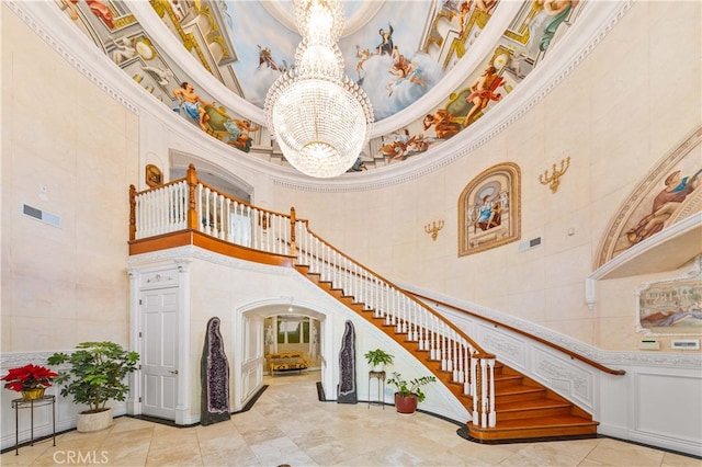 1782 Chota Rd, La Habra Heights, CA 90631 - stairs with a towering ceiling, a chandelier, crown molding, and tile patterned floors
