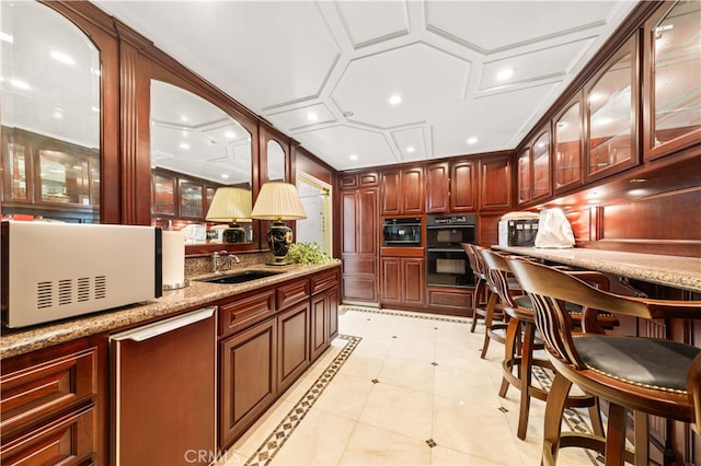 1782 Chota Rd, La Habra Heights, CA 90631 - kitchen featuring a sink, glass insert cabinets, white microwave, light stone counters, and recessed lighting