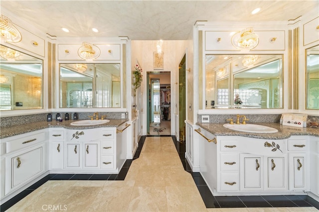 1782 Chota Rd, La Habra Heights, CA 90631 - bathroom with two vanities, a walk in closet, tile patterned flooring, and recessed lighting