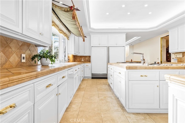 1782 Chota Rd, La Habra Heights, CA 90631 - kitchen featuring a sink, white cabinets, tasteful backsplash, light tile patterned floors, and recessed lighting