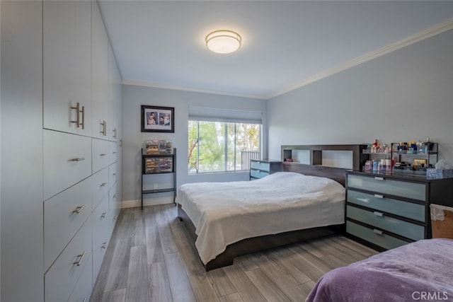 1517 E Garfield Ave Unit 94, Glendale, CA 91205 - bedroom with ornamental molding, wood finished floors, and baseboards