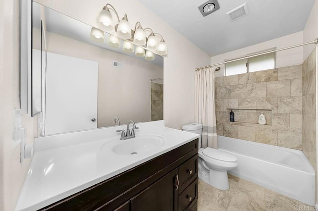 bathroom with vanity, shower / tub combo with curtain, and toilet