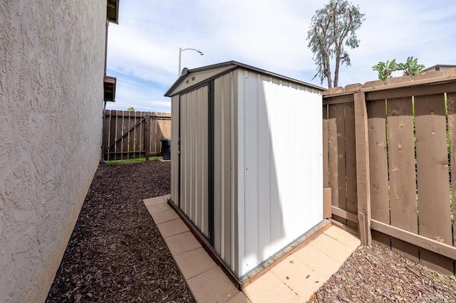 view of shed featuring a fenced backyard