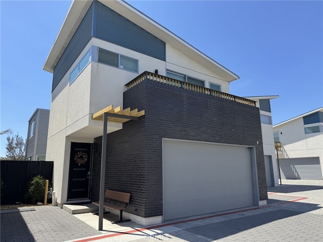 1166 Holly Ave Unit 4, Imperial Beach, CA 91932 - contemporary home with brick siding, a garage, fence, and stucco siding