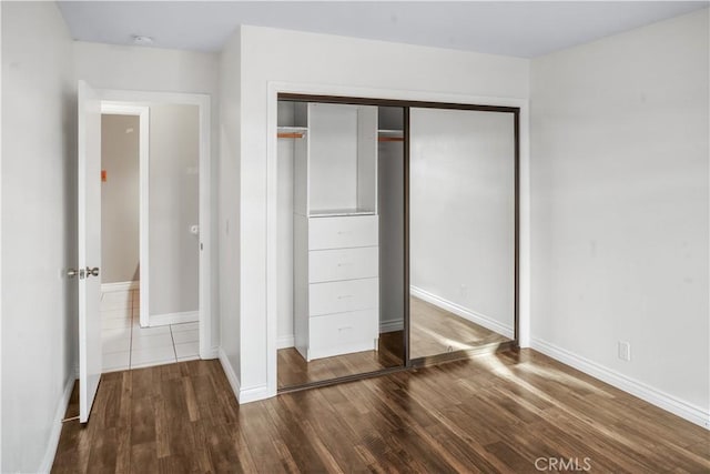 27535 Lakeview Dr Unit 37, Helendale, CA 92342 - unfurnished bedroom with wood finished floors and a closet