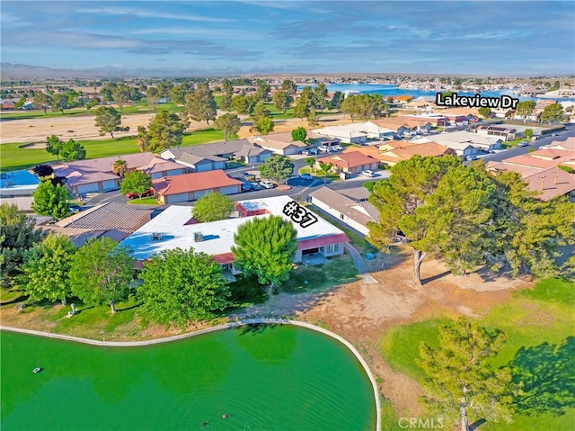 aerial perspective of suburban area featuring a large body of water