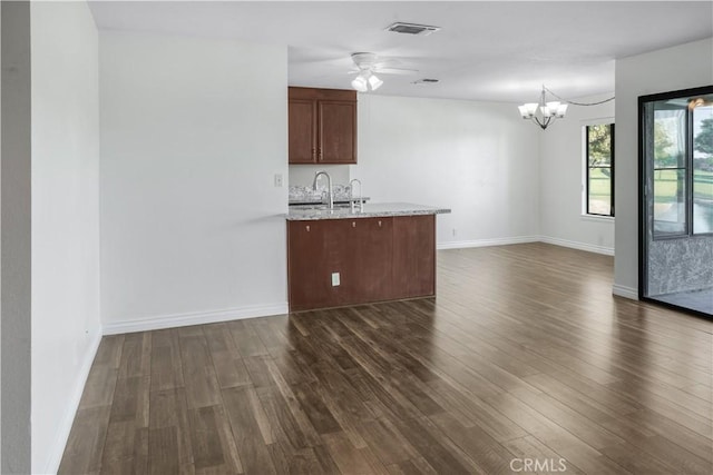 27535 Lakeview Dr Unit 37, Helendale, CA 92342 - kitchen featuring dark wood-style flooring, a chandelier, open floor plan, and a ceiling fan