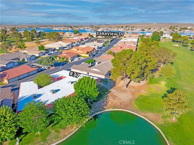 aerial view of residential area featuring a nearby body of water