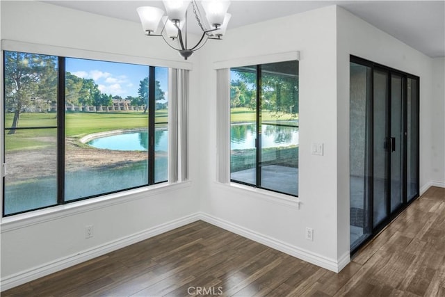 27535 Lakeview Dr Unit 37, Helendale, CA 92342 - unfurnished dining area with dark wood-style flooring and a chandelier
