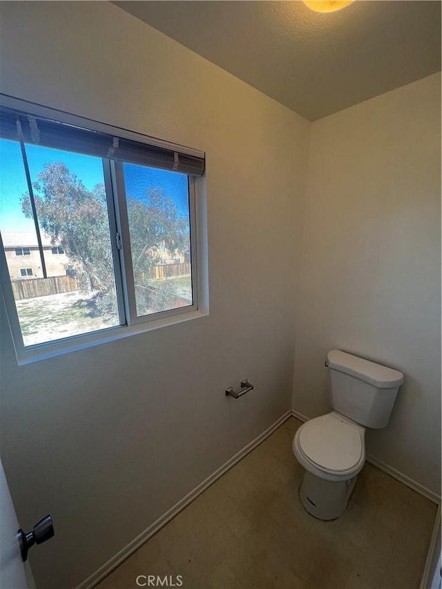 12418 Firefly Way, Victorville, CA 92392 - bathroom featuring toilet, baseboards, and tile patterned floors